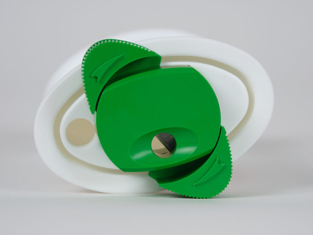 Portable sharps disposal container with cutting tool