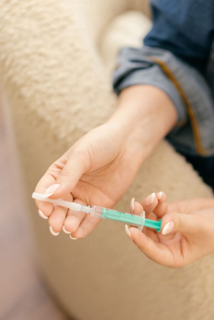 woman holding a syringe